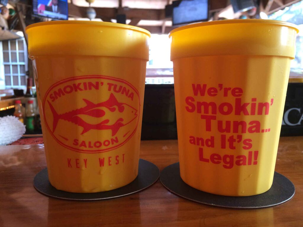 two plastic smokin' tuna cups on the bar