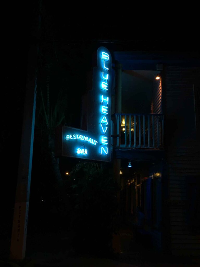 neon blue sign for blue heaven at night