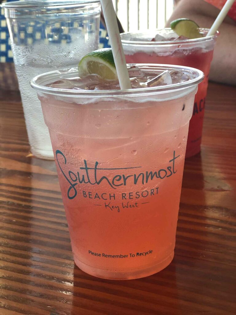 strawberry margarita in a southernmost resort cup on the bar