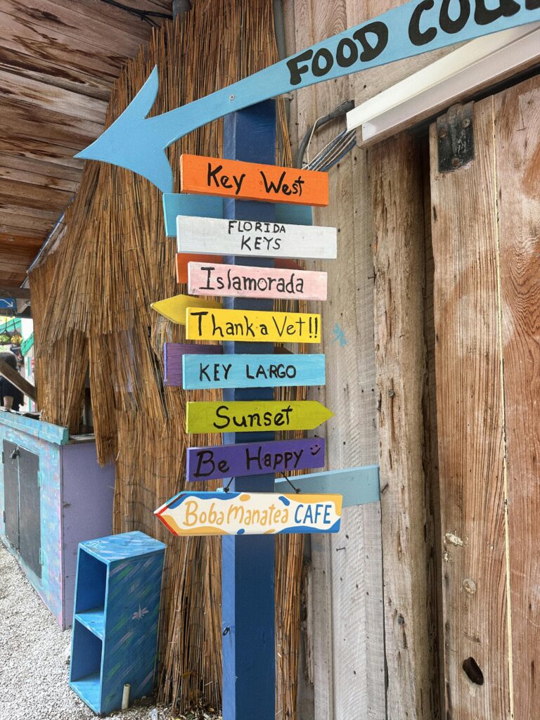 signs showing how far places are in the keys