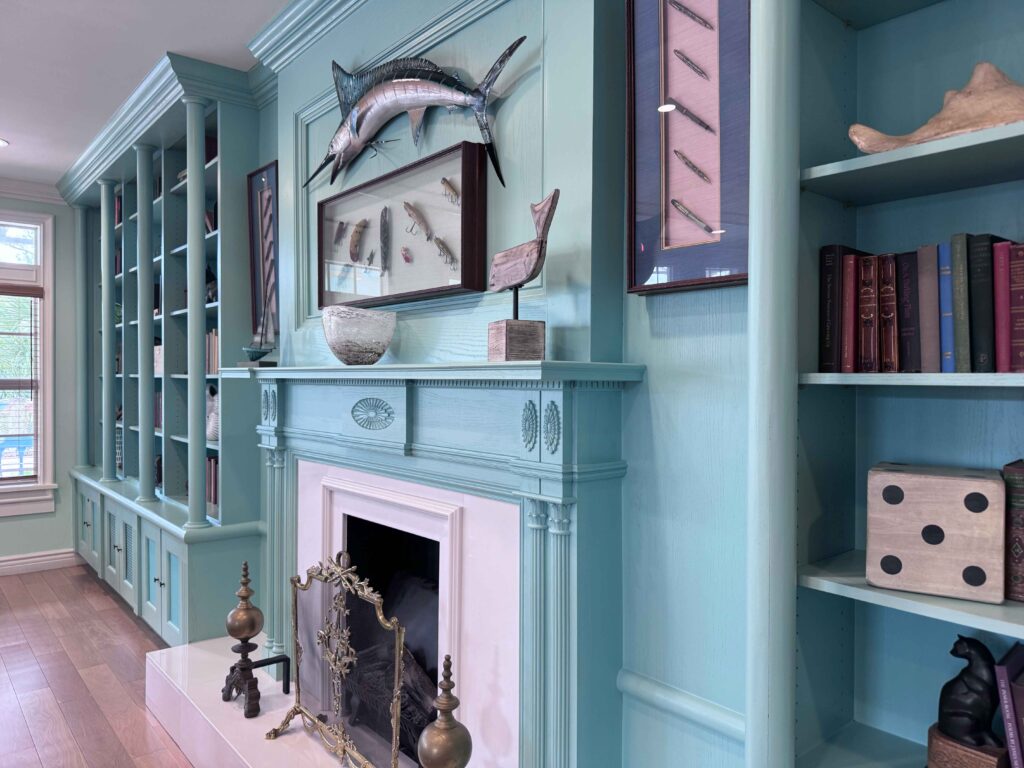 bookshelves filled with mementos from traveling and old books